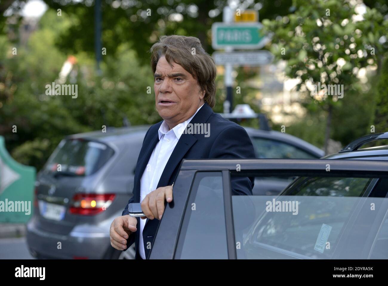 Bernard Tapie arrives to attend a broadcasted debate on French news channel  iTele in Paris, France on July 10, 2013 as French investigators have  ordered today some of his assets seized as