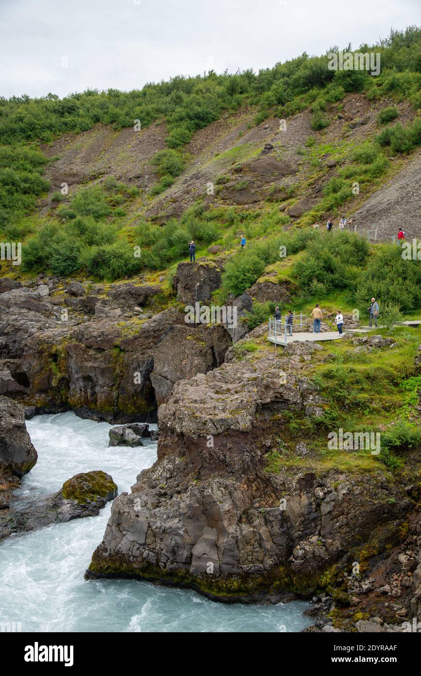 vistors at Hraunfossar waterfall on Iceland Stock Photo