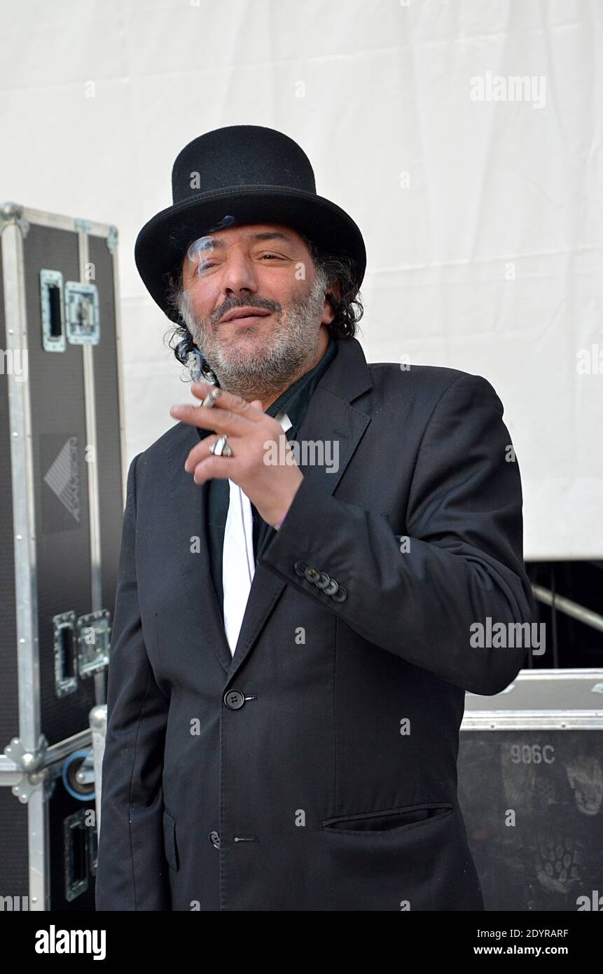 Rachid Taha poses for photographs during the 3rd OUI FM radio station's  Soirs d'Ete music festival held on Place de la Republique square in Paris,  France, on July 12, 2013. Photo by