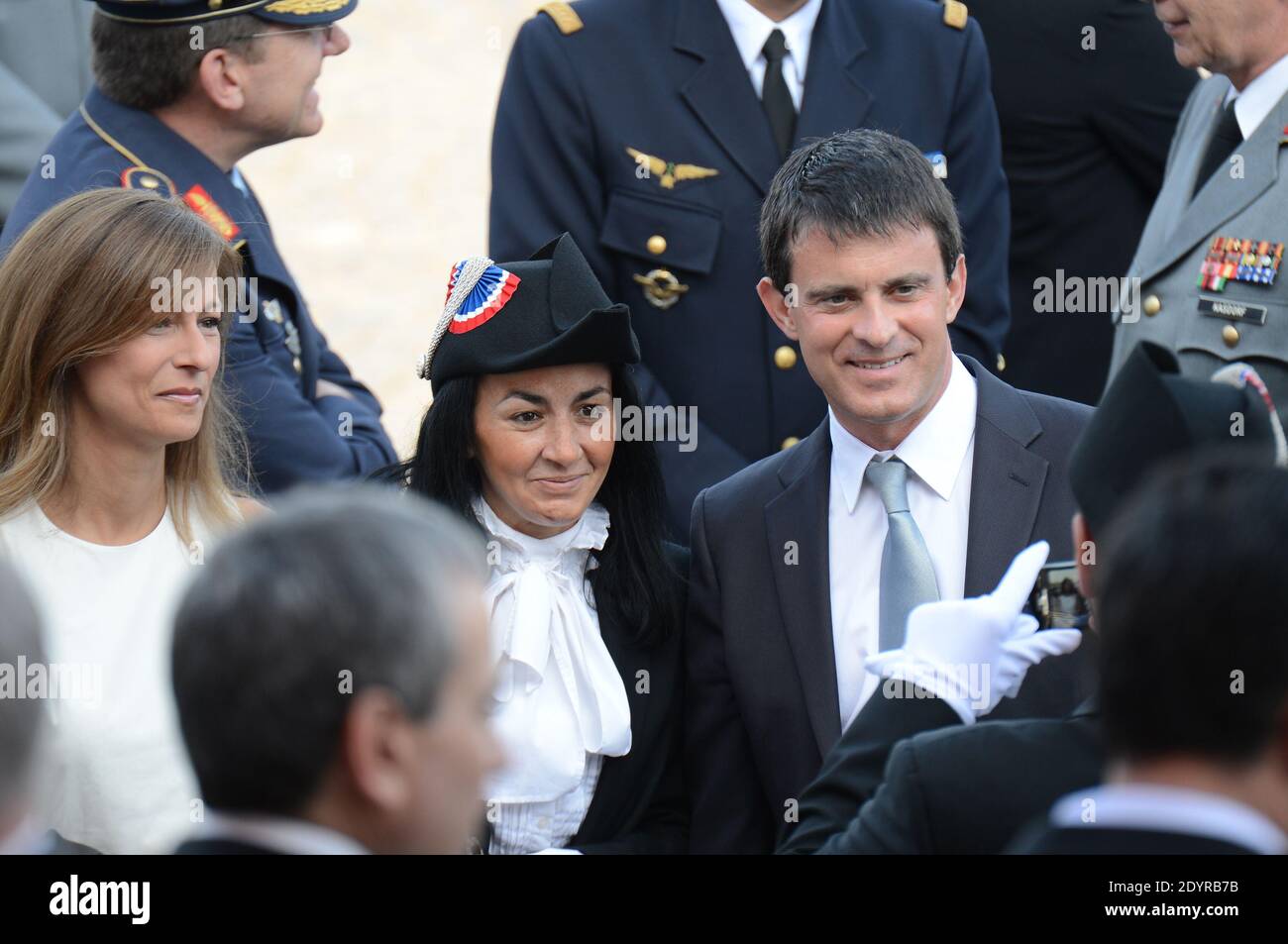 Manuel Valls and wife Anne Gravoin attending the 2013 annual Bastille Day military parade on Place de la Concorde square in Paris, France on July 14, 2013. Photo by Ammar Abd Rabbo/ABACAPRESS.COM Stock Photo