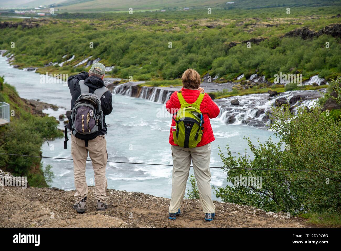 vistors at Hraunfossar waterfall on Iceland Stock Photo