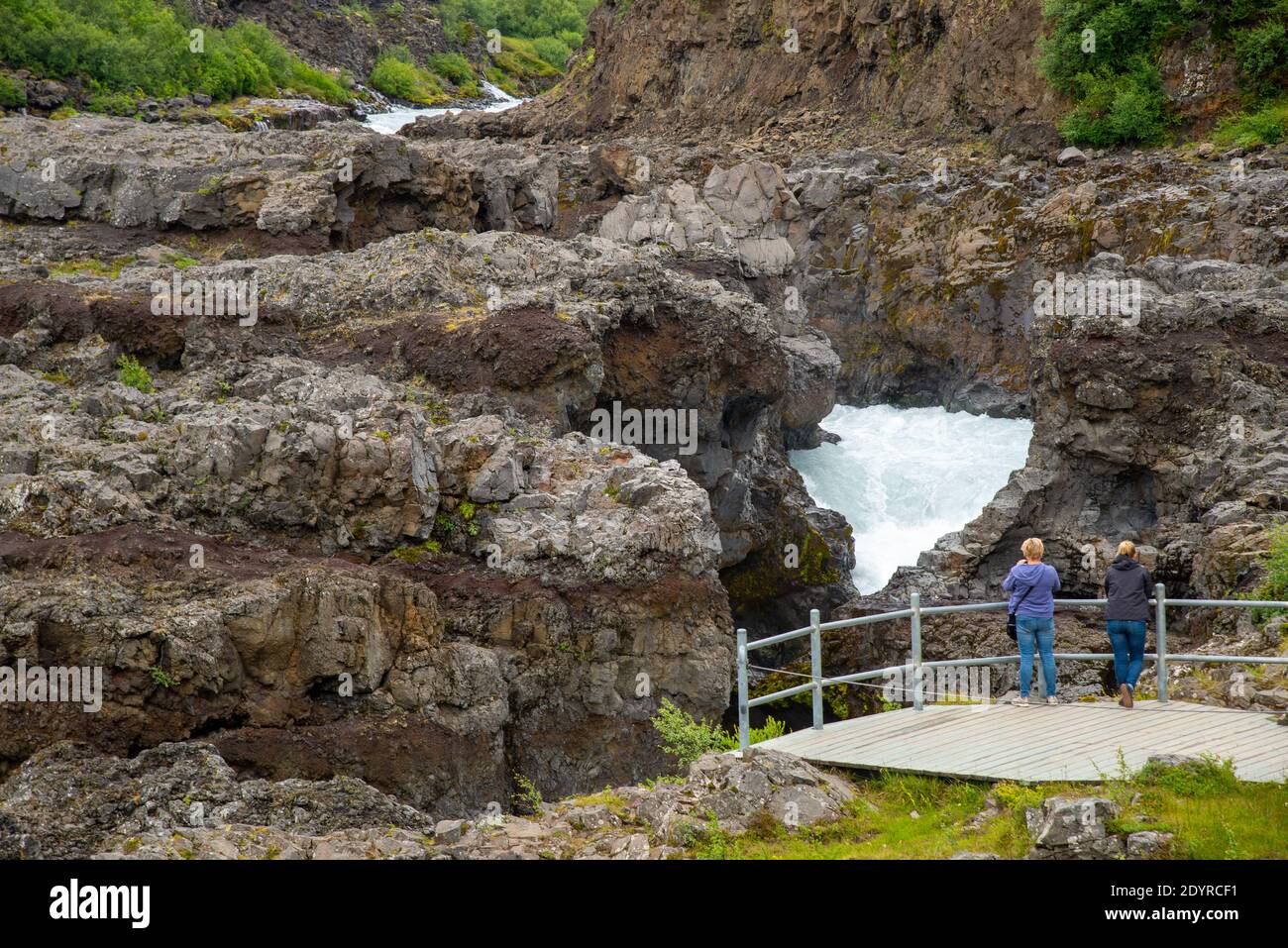 vistors at Hraunfossar waterfall on Iceland Stock Photo