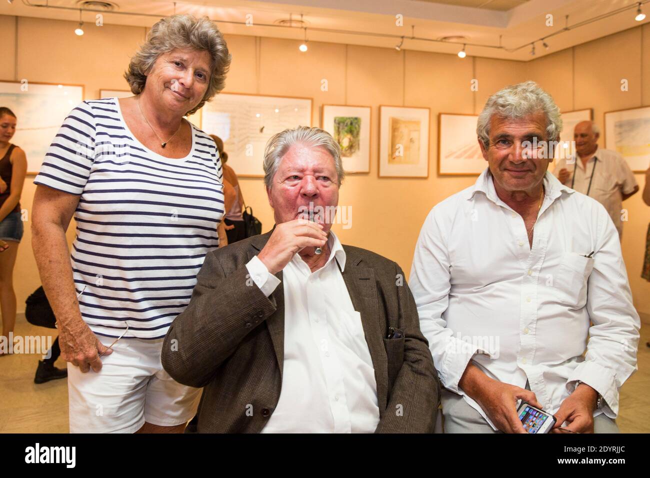 EXCLUSIVE. French cartoonist Jean-Jacques Sempe poses with Jacqueline Franjou and Michel Boujenah during the opening of his drawing exhibition in Ramatuelle, south of France on July 31, 2013. Photo by Cyril Bruneau/ABACAPRESS.COM Stock Photo