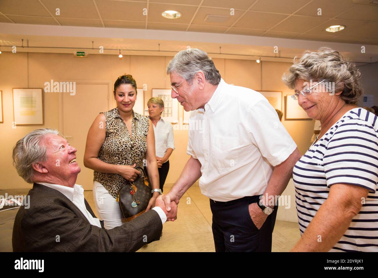EXCLUSIVE. French cartoonist Jean-Jacques Sempe poses with Jacqueline Franjou and Ramatuelle Mayor, Roland Bruno during the opening of his drawing exhibition in Ramatuelle, south of France on July 31, 2013. Photo by Cyril Bruneau/ABACAPRESS.COM Stock Photo