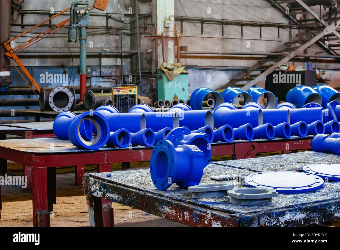 Cast metal blue pipe connection parts at Stock Photo Alamy