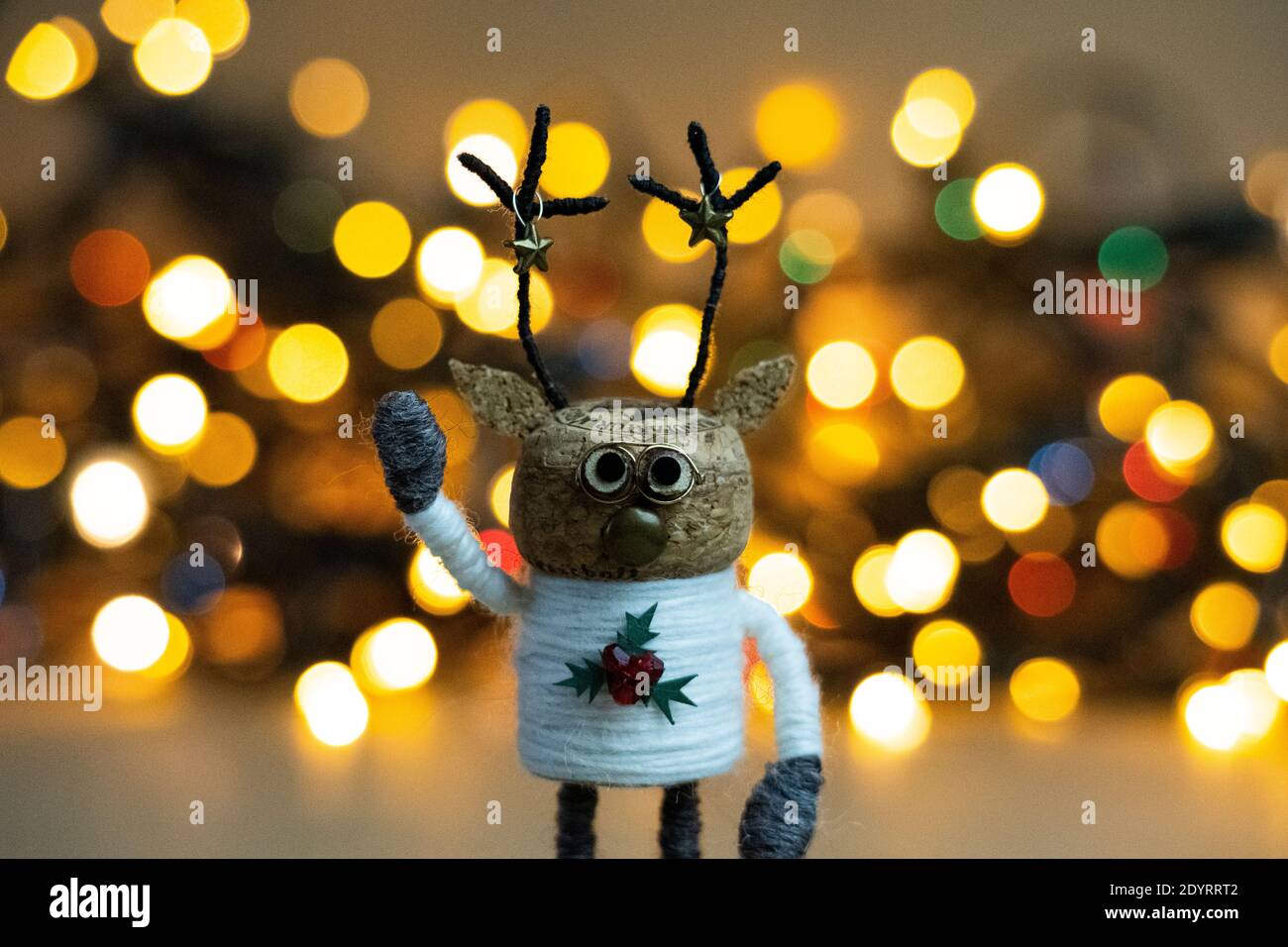 Creative Christmas. Winter Scene. Christmas Concept. cork deer. festive deer. Christmas lights. miniature deer figure. Stock Photo
