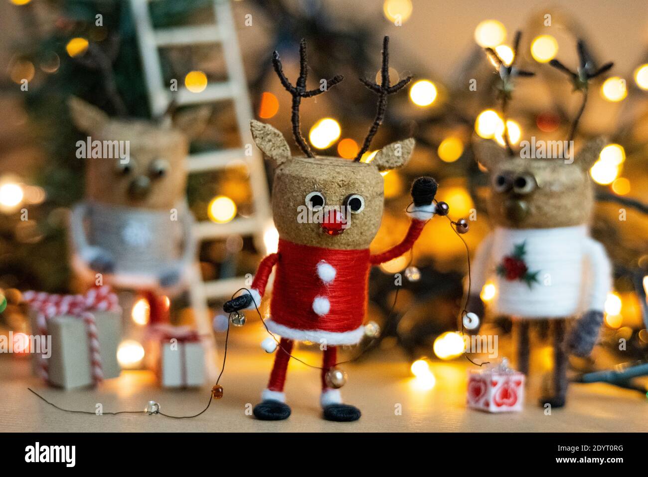 Creative Christmas Concept Winter Festive Cork deer figures celebrating Boxing Day in Santa suit Scandinavian concept recycled Christmas ornaments Stock Photo