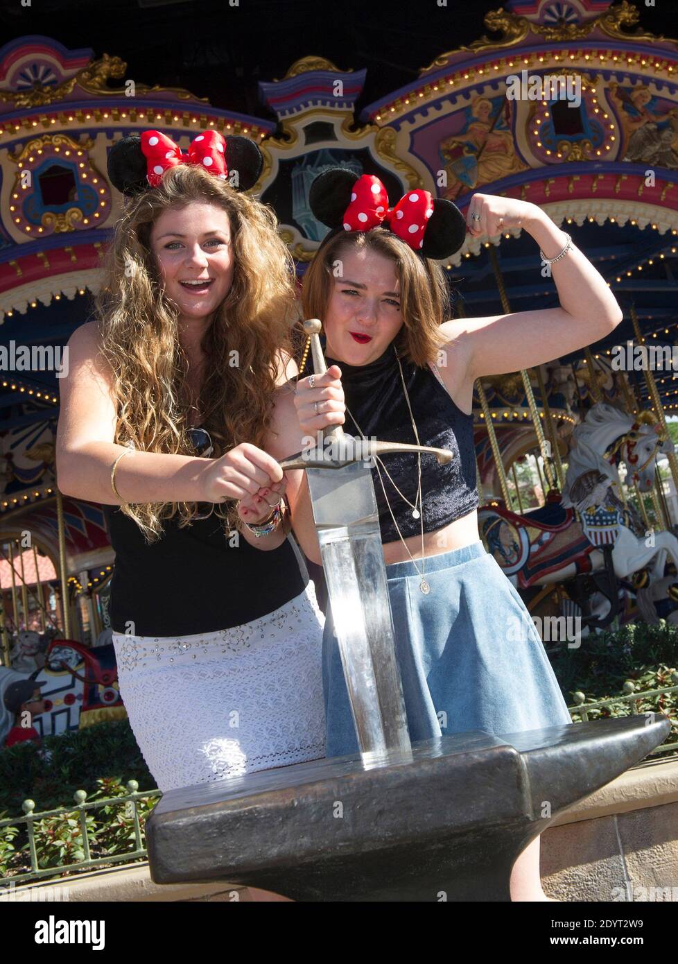 Actress Maisie Williams (right), who portrays Arya Stark on the HBO series 'Game of Thrones,' poses with her friend Cassidy Waterhouse (left), after pulling the sword from the stone at the Magic Kingdom park at Walt Disney World Resort in Lake Buena Vista, Florida on August 29, 2013. The 16-year-old English actress has starred on the award-winning series since its premiere episode. Photo by Gene Duncan/Disney Handout/ABACAPRESS.COM Stock Photo