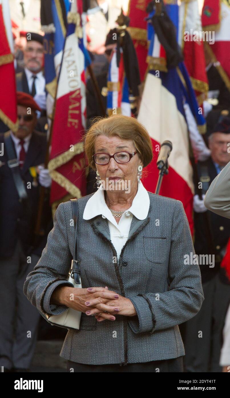 The wife of Late French veteran Helie Denoix de Saint-Marc pays homage to her husband as he receives military honors, on August, 30, 2013, during his funeral ceremony at the Saint-Jean Cathedral, in Lyon. Helie Denoix de Saint-Marc was a member of the French Resistance, deported to the Buchenwald camp during WWII, who fought during Indochina (1945-54) and Algeria (1954-61) wars. He was jailed after the 1961 putsch in Algiers. Helie Denoix de Saint-Marc died at the age of 91 on August 25, 2013 Stock Photo