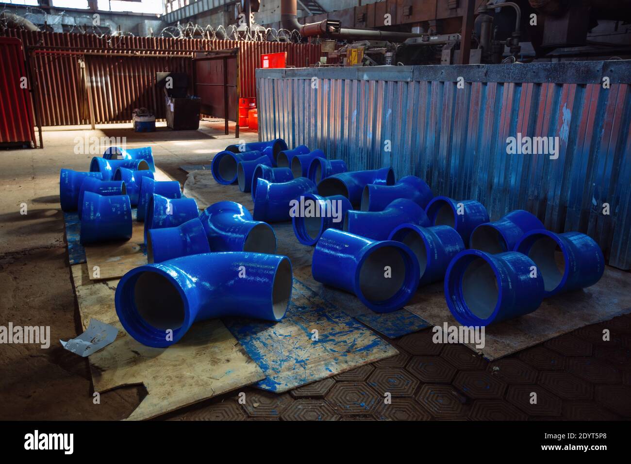 Cast metal blue pipe connection parts at Stock Photo Alamy