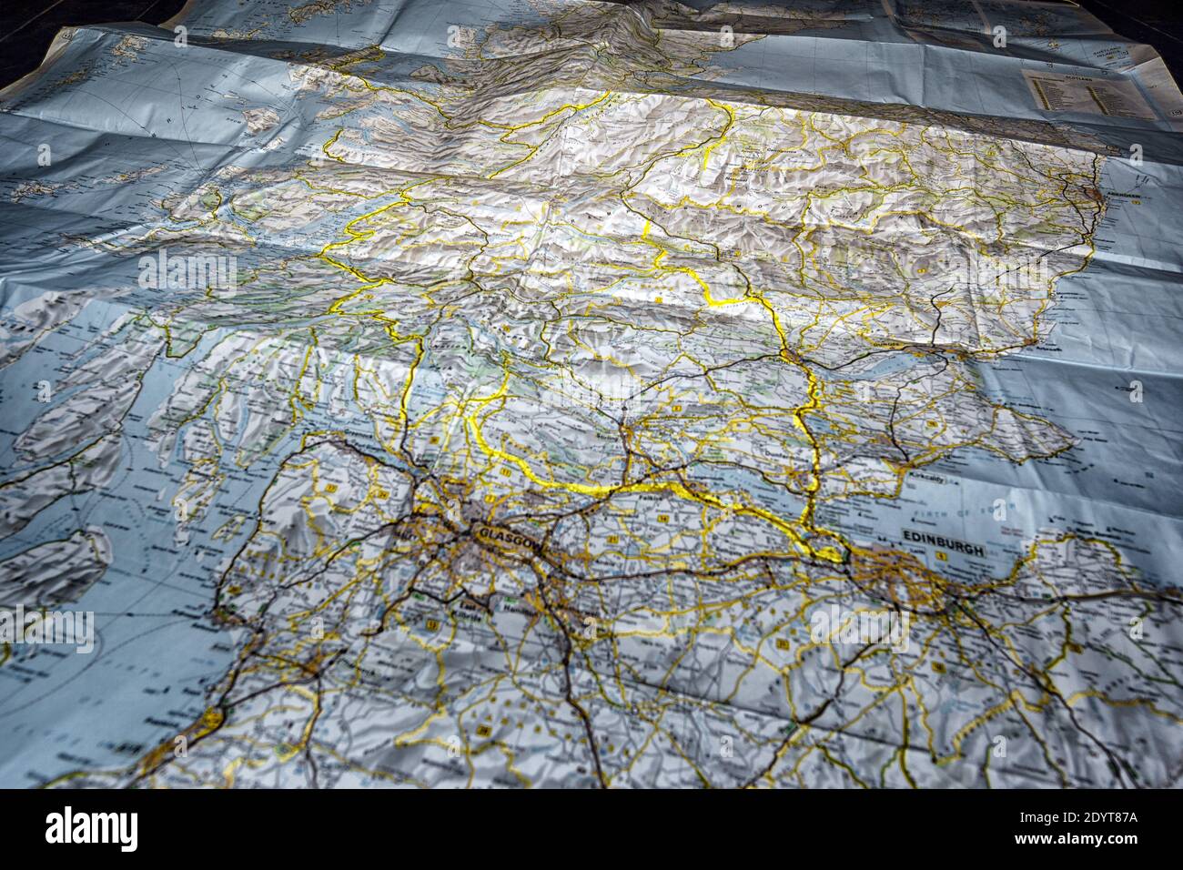 Paper road trip map of scotland with marked road Stock Photo