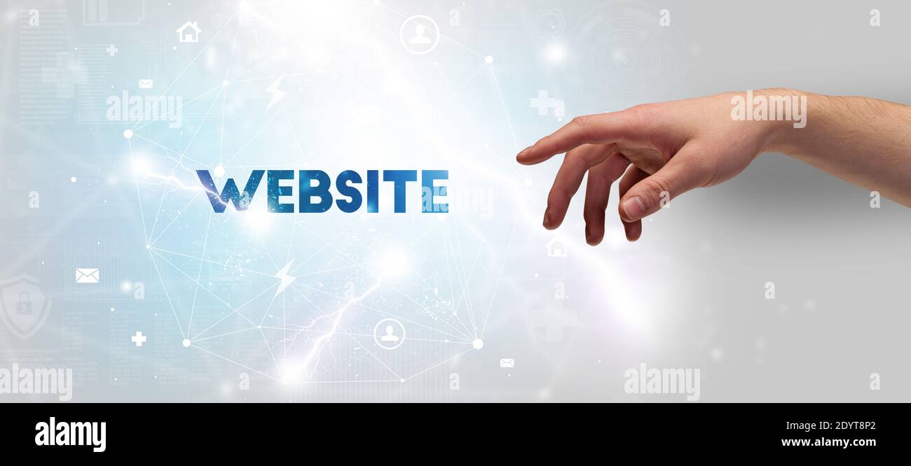 Webiste Hand Sign Hand pointing at WEBSITE inscription, modern technology concept Stock ...