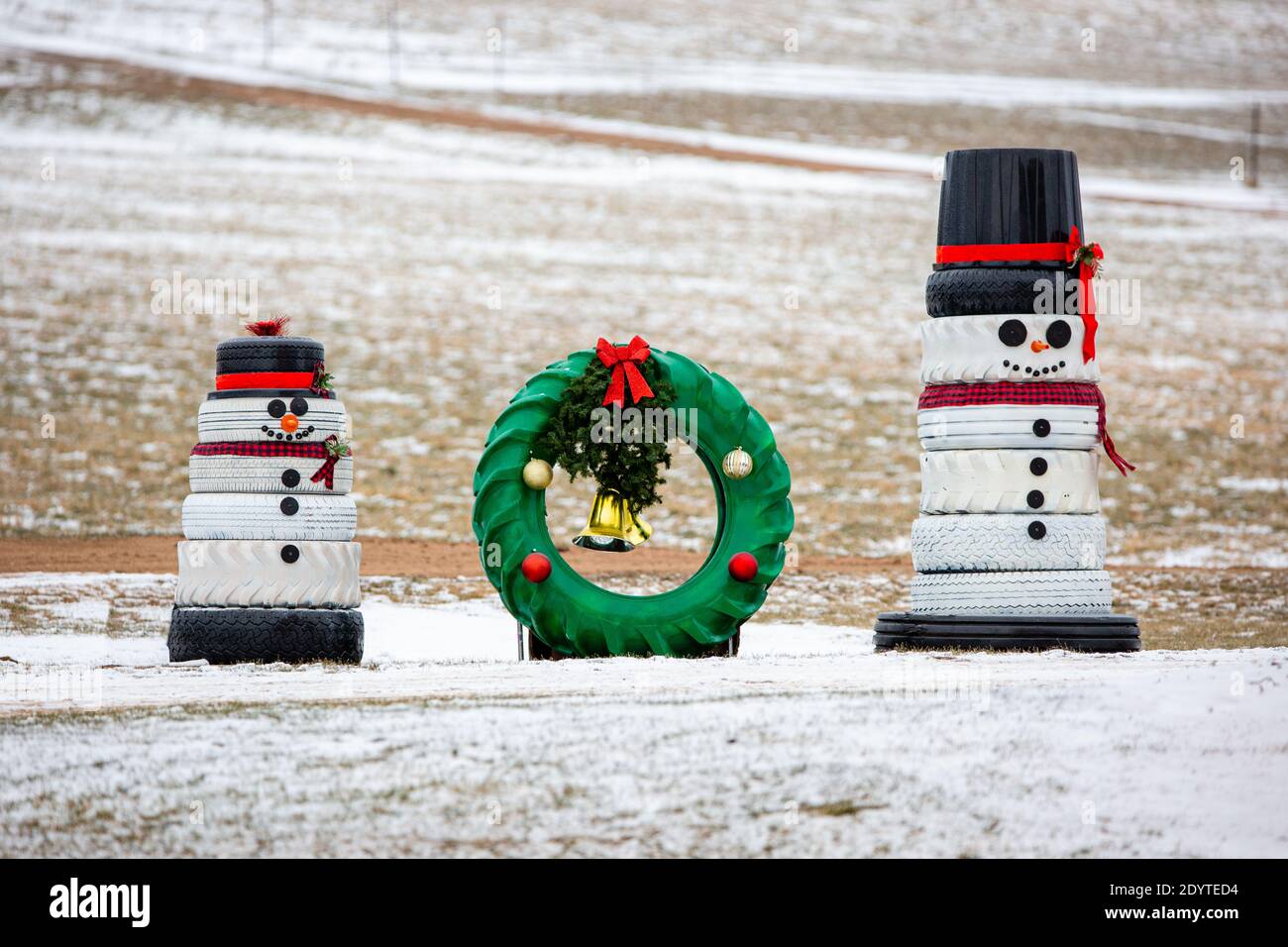 Snowmen and a wreath made out of recycled tires for Christmas decorations, horizontal Stock Photo