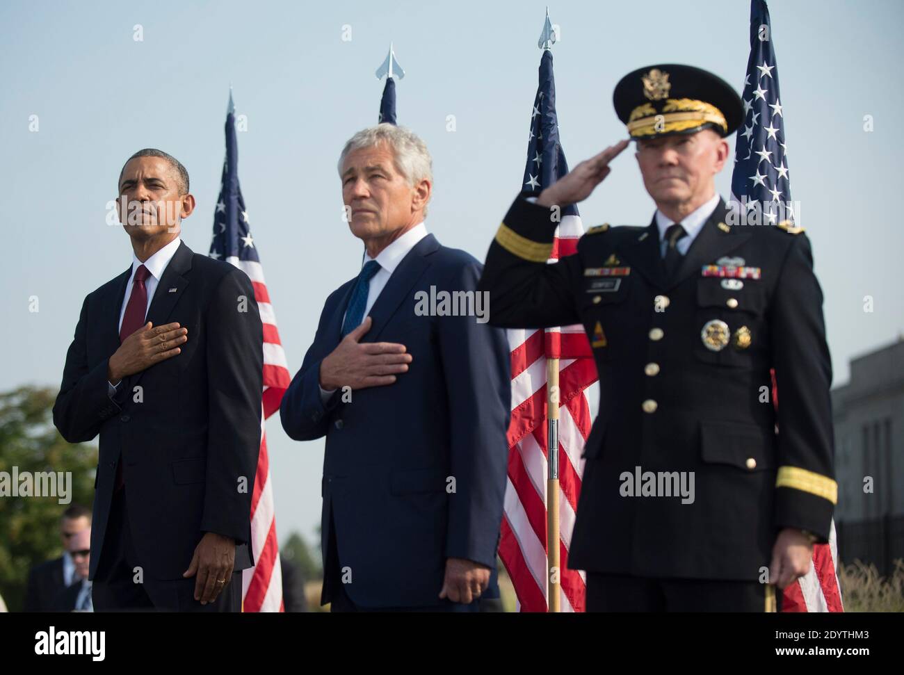 President Barack Obama (left), Defense Secretary Chuck Hagel (center), and Chairman of the Joint Chiefs of Staff Martin Dempsey stand during a remembrance ceremony for the 12th anniversary of the 9/11 terrorist attacks, at the Pentagon in Arlington, Virginia, USA on September 11, 2013. Photo by Kevin Dietsch/UPI/Pool/ABACAPRESS.COM Stock Photo