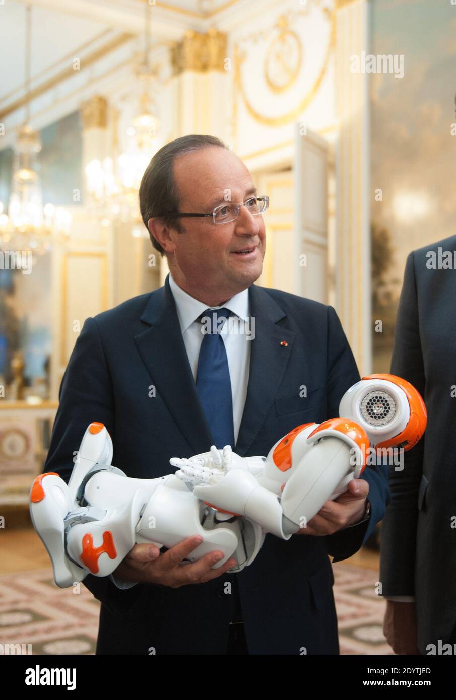 France's President Francois Hollande holds an humanoid robot 'Nao' from Aldebaran Robotics company as he visits an exhibition on French industrial design and technology at the Elysee Palace in Paris, France on September 12, 2013. Photo by Thierry Orban/ABACAPRESS.COM Stock Photo