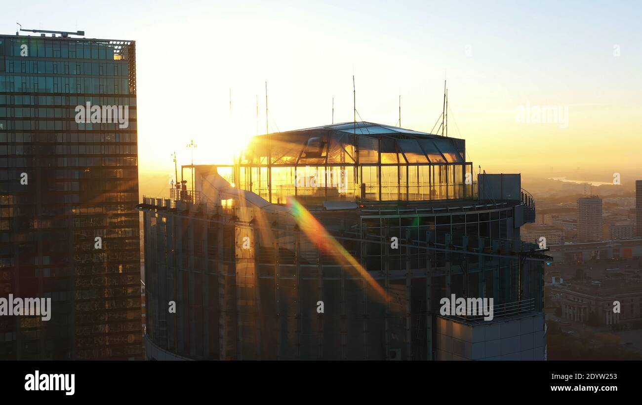 Warsaw, Poland 01.11.2020 Golden sunrise over the Warsaw office tower Spektrum tower and club The View. Aerial. High quality photo Stock Photo