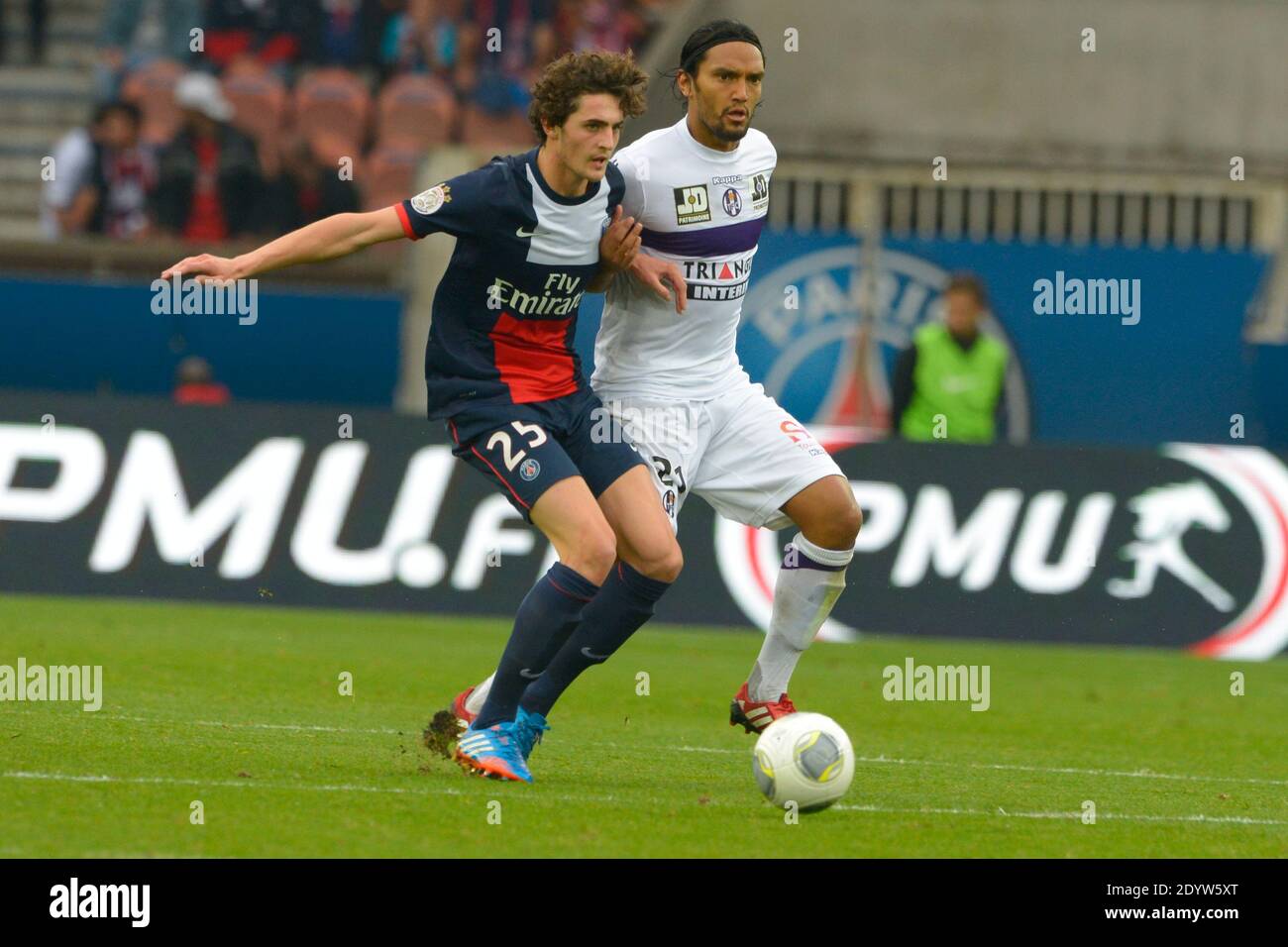 PSG's Adrien Rabiot battling Toulouse's Abel Aguilar during the French First League soccer match, PSG vs Toulouse in Paris, France, on September 28th, 2013. PSG won 2-0. Photo by Henri Szwarc/ABACAPRESS.COM Stock Photo