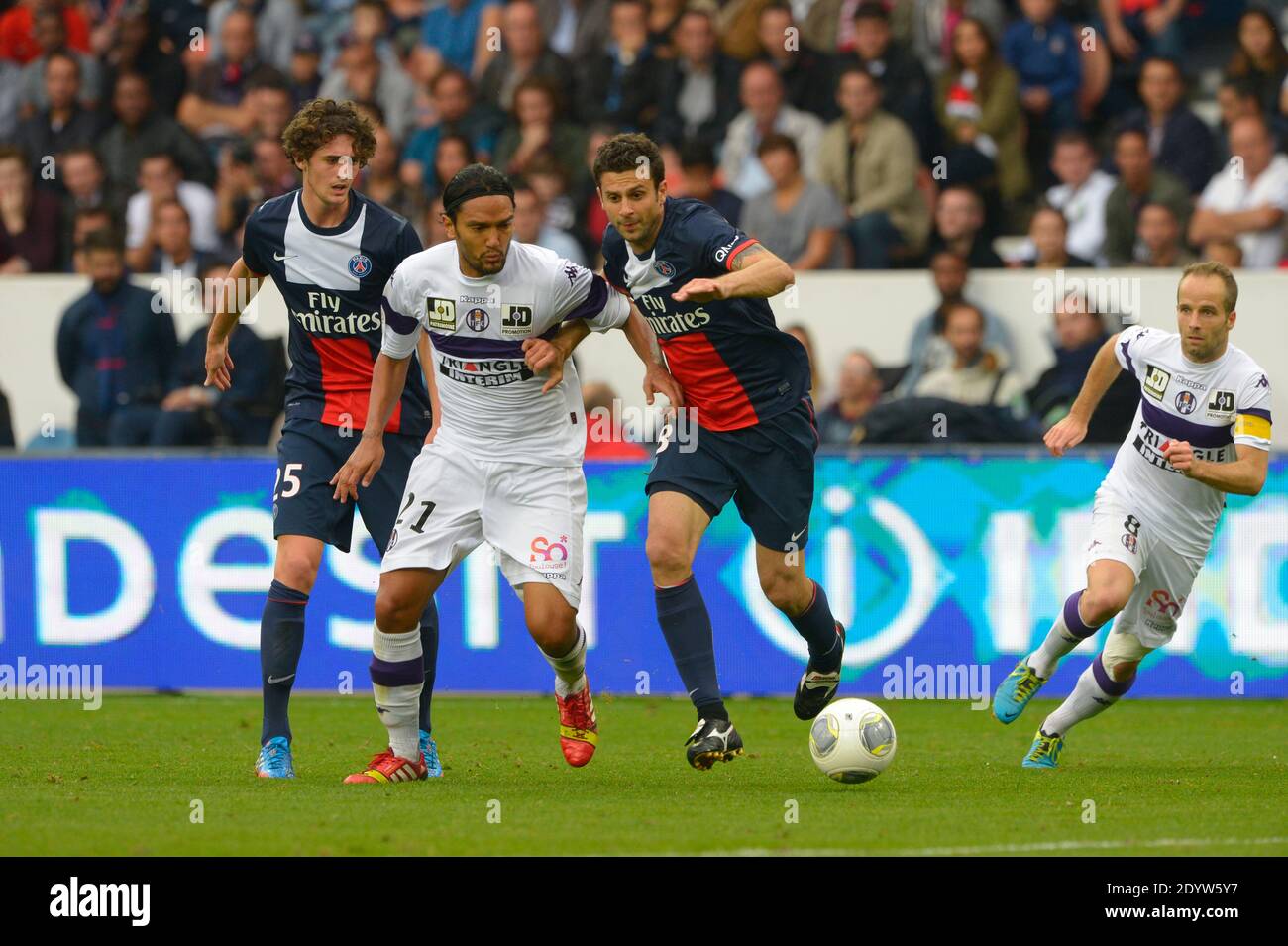 PSG's Thiago Motta battling Toulouse's Abel Aguilar during the French First League soccer match, PSG vs Toulouse in Paris, France, on September 28th, 2013. PSG won 2-0. Photo by Henri Szwarc/ABACAPRESS.COM Stock Photo