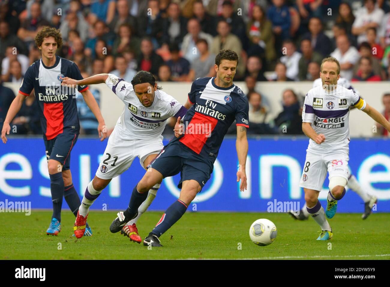 PSG's Thiago Motta battling Toulouse's Abel Aguilar during the French First League soccer match, PSG vs Toulouse in Paris, France, on September 28th, 2013. PSG won 2-0. Photo by Henri Szwarc/ABACAPRESS.COM Stock Photo