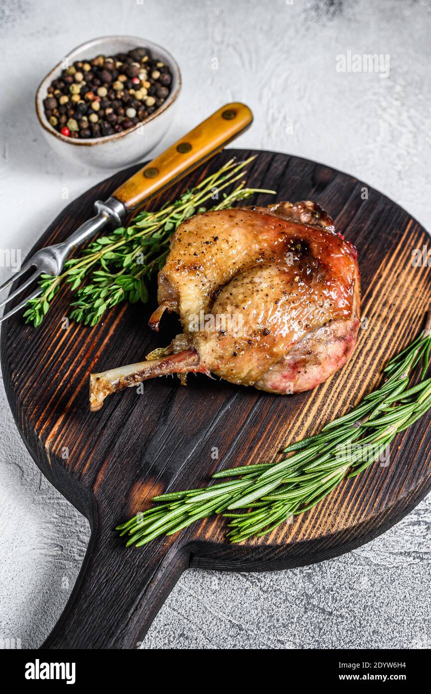 Fried duck confit leg baked poultry meat. White background. top view Stock Photo Alamy