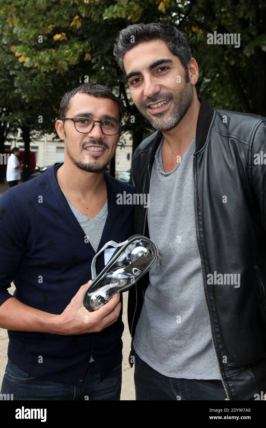 Brahim Asloum and Ary Abittan attending The Petanque Tournament to benefit the association 'Meghanora' held at Place des Invalides in Paris, France, on September 29, 2013. Photo by Audrey Poree/ABACAPRESS.COM Stock Photo
