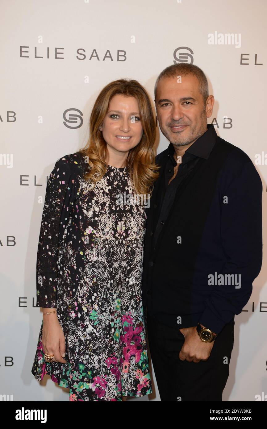 Lebanese designer Elie Saab poses with his wife Claudine after his  Spring-Summer 2014 Ready-To-Wear collection show held at Espace Tuileries  in Paris, France, on September 30, 2013. Photo by Ammar Abd  Rabbo/ABACAPRESS.COM