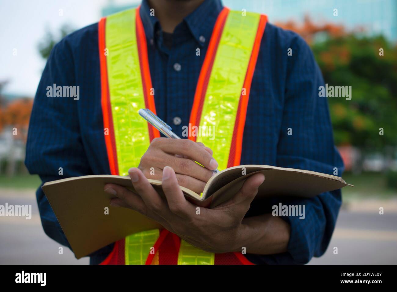 Engineer write take note on book for planing work Stock Photo