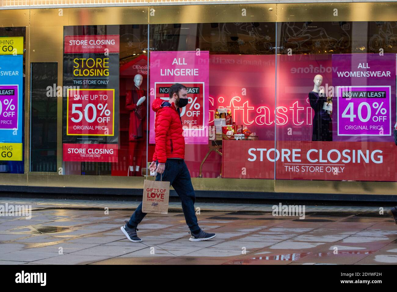 London, UK. 27th Dec, 2020. A man walks past a Closed Debenhams Store in Oxford Street.Under tier four restrictions, pubs and restaurants will close, as well as ‘non-essential' retail. Credit: SOPA Images Limited/Alamy Live News Stock Photo