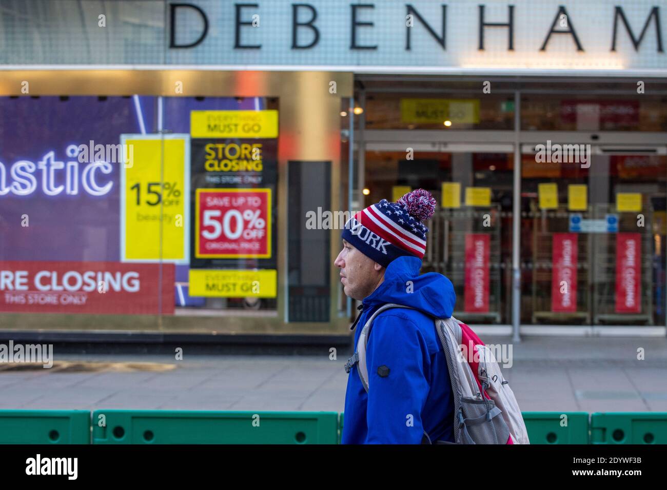 London, UK. 27th Dec, 2020. A man walks past a Closed Debenhams Store in Oxford Street.Under tier four restrictions, pubs and restaurants will close, as well as ‘non-essential' retail. Credit: SOPA Images Limited/Alamy Live News Stock Photo