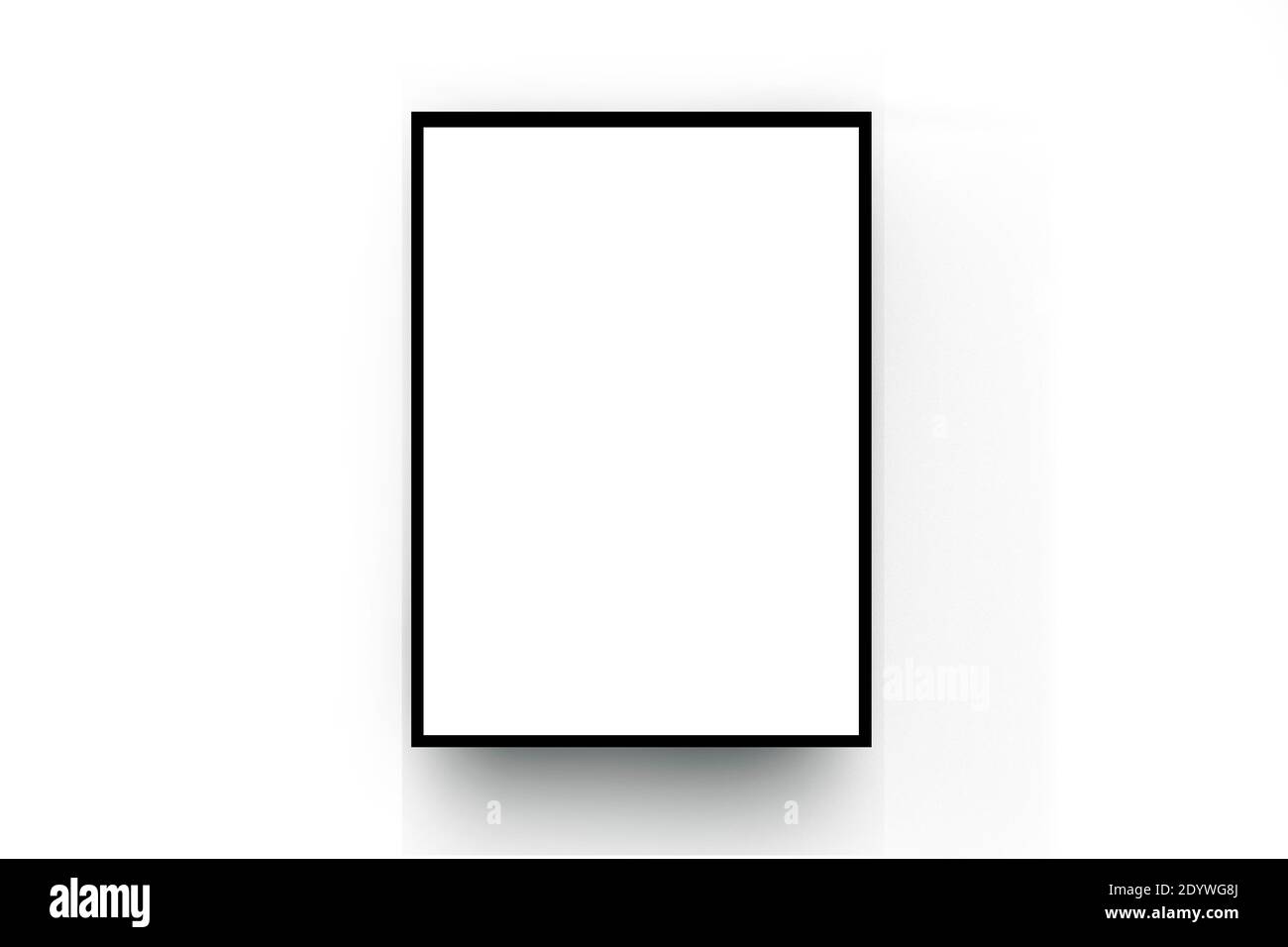 White poster, black wood frame on the white room wall Stock Photo