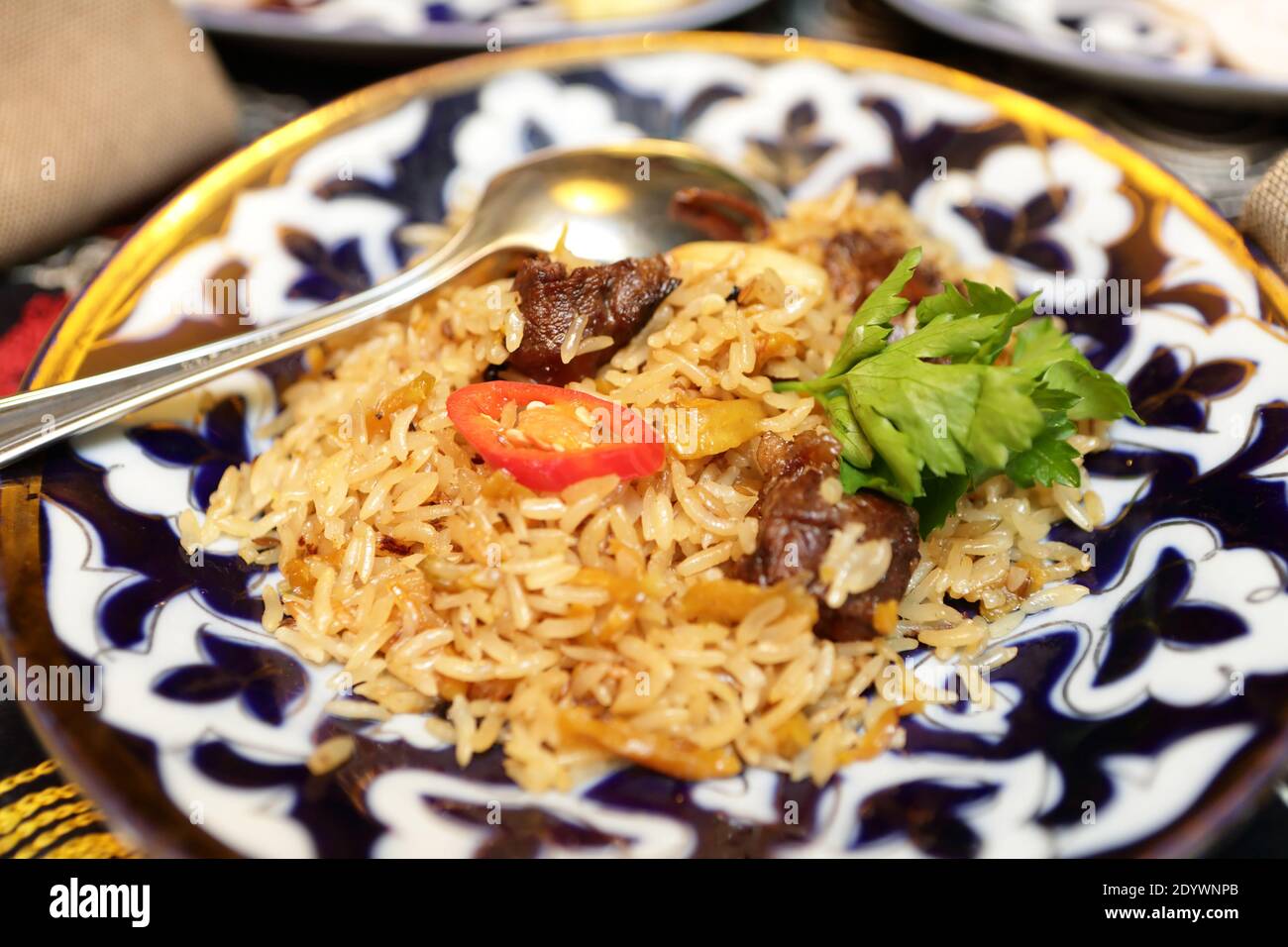 Plate with pilaf in an uzbek restaurant Stock Photo Alamy