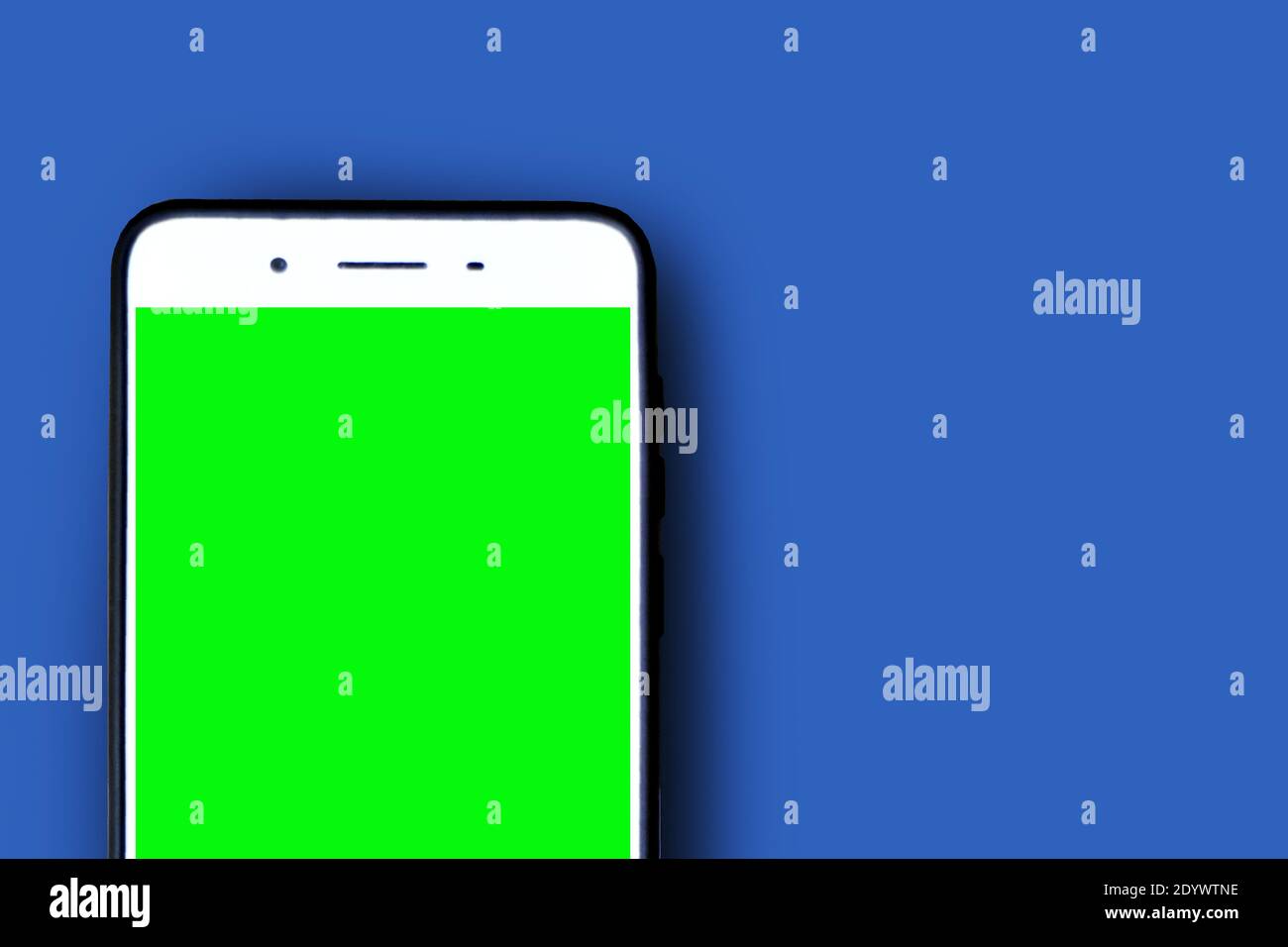 Smartphone green screen on blue background Stock Photo Alamy