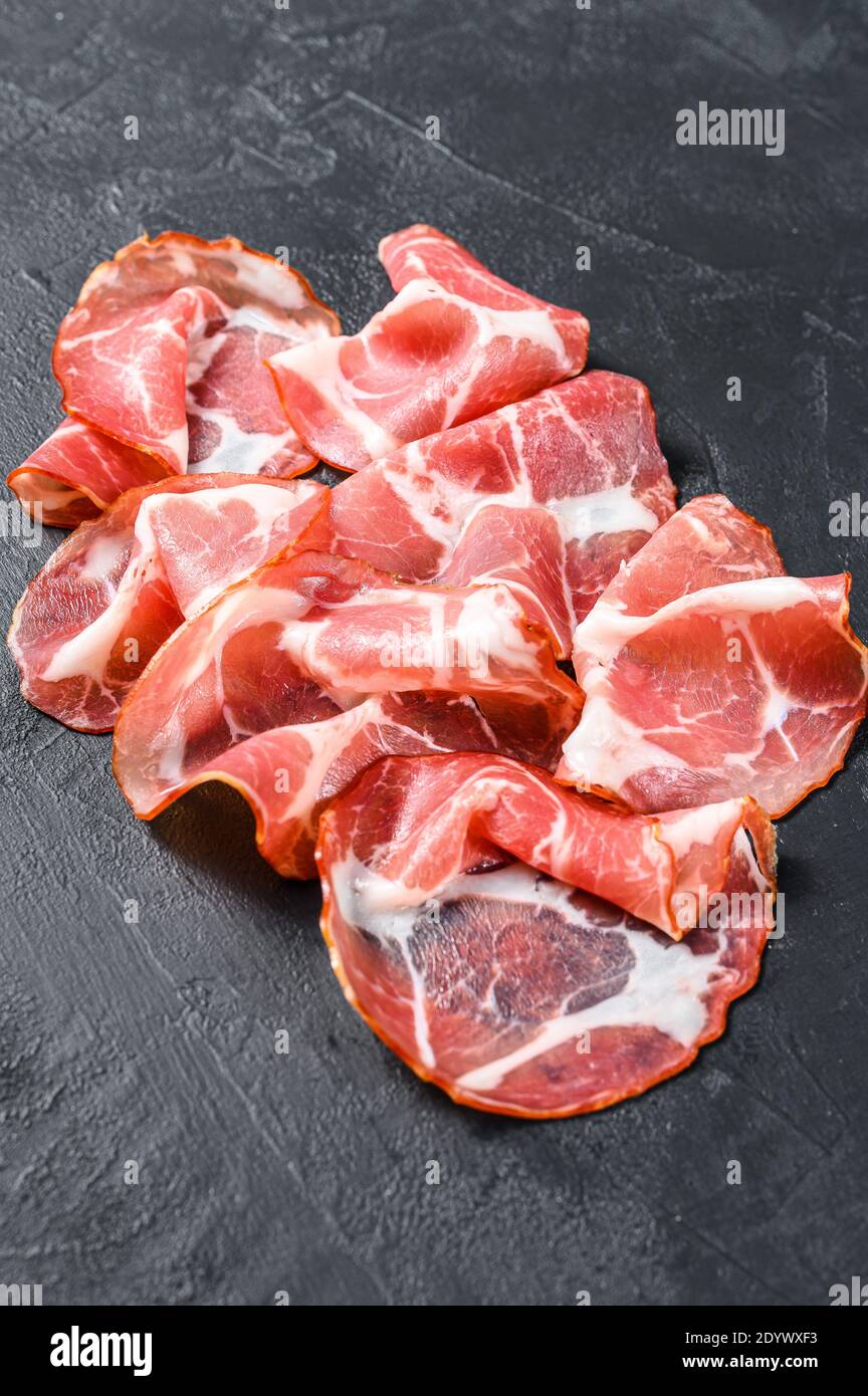 Coppa, Capocollo, Capicollo meat. Black background. Top view Stock