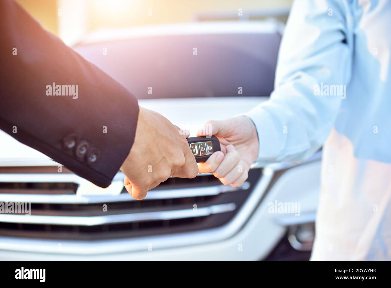 Salesman giving key car to customer,Car sale concept Stock Photo - Alamy
