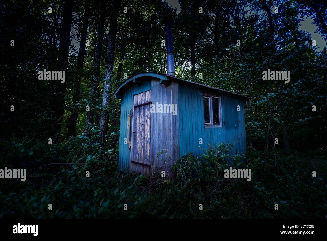 Old Caravan in an Forest Stock Photo