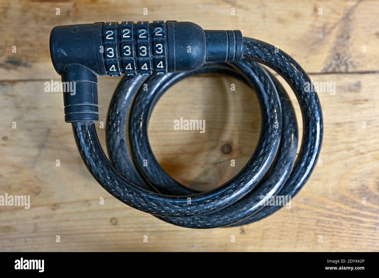 wire with combination lock for bikes rolled up Stock Photo