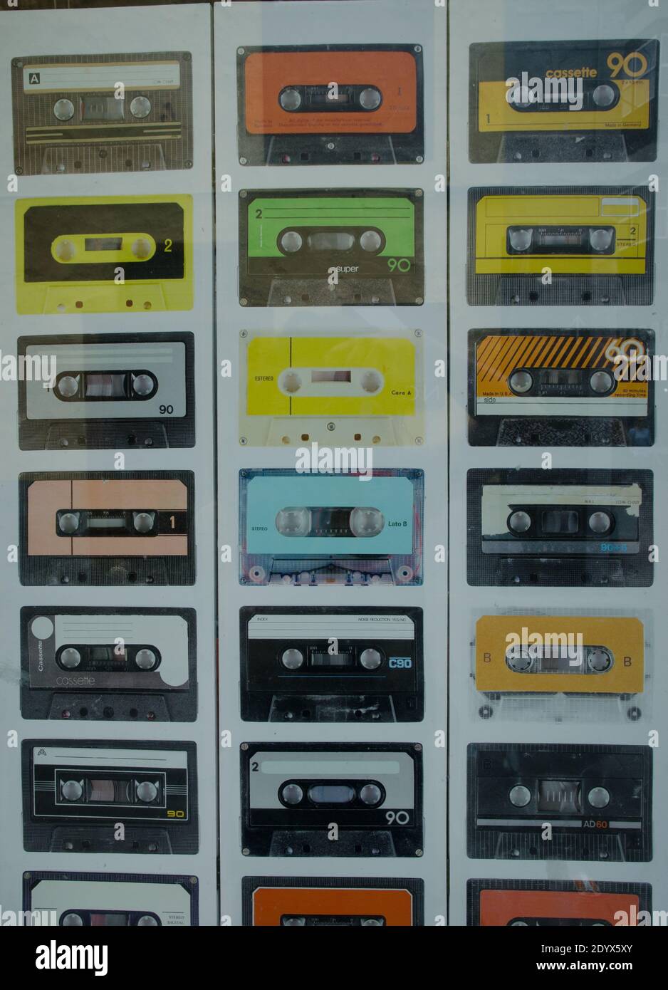 Images of cassette tapes on a poster in the shop window. San Cristobal