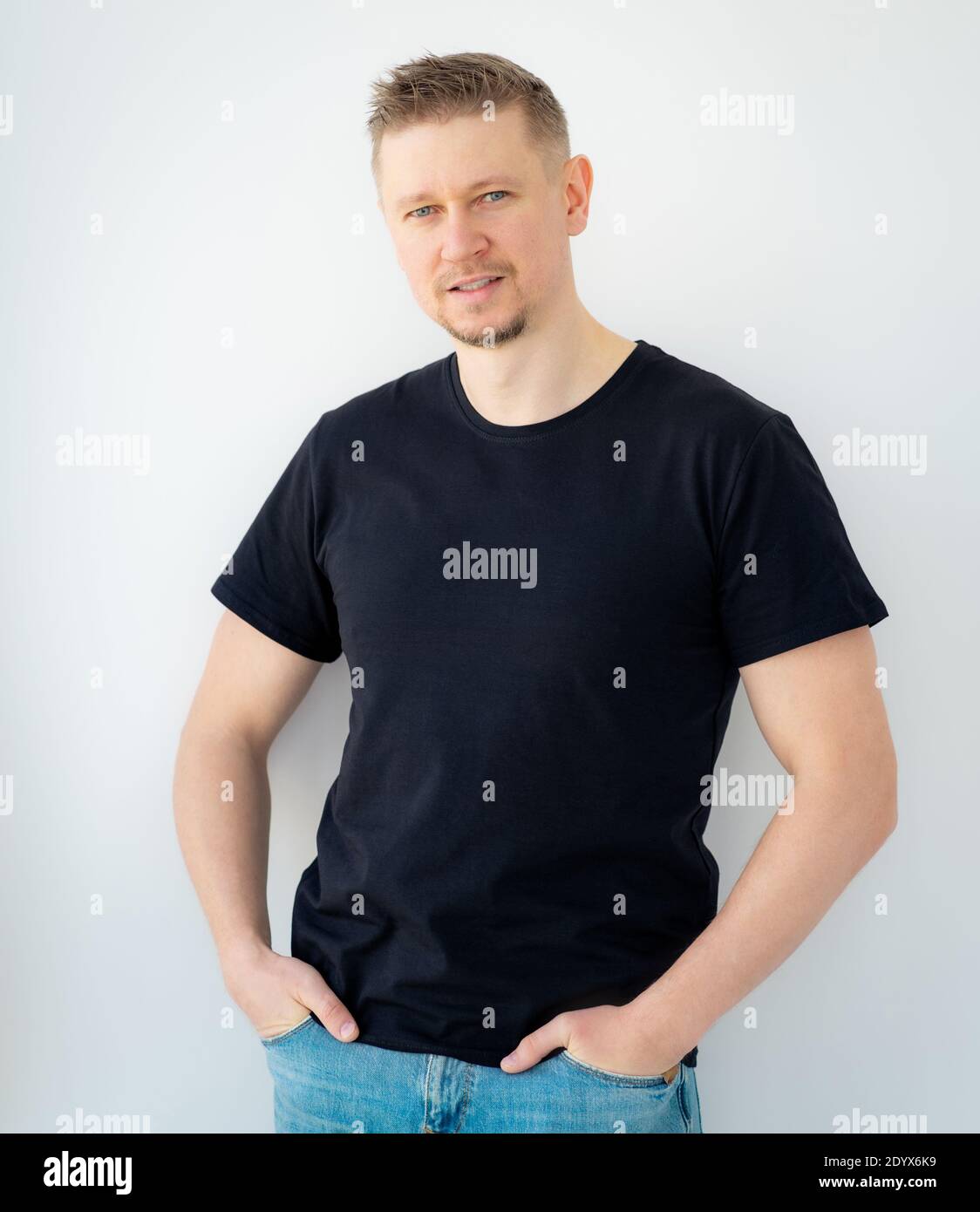 Handsome man posing in black blank t-shirt Stock Photo