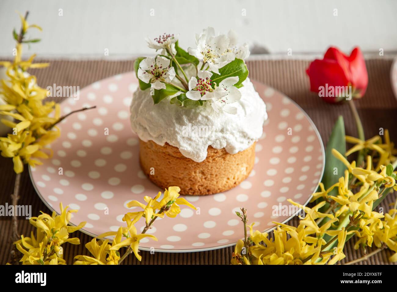 Spring composition with Easter cake on a beautiful plate close up. Stock Photo