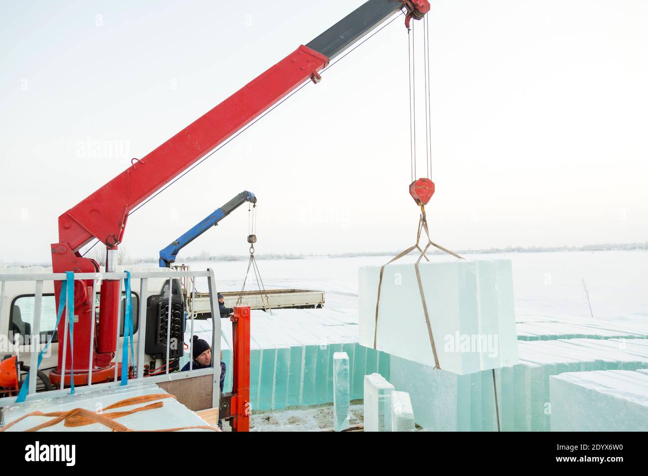 Portrait of a hydraulic crane operator loading ice panels Stock Photo
