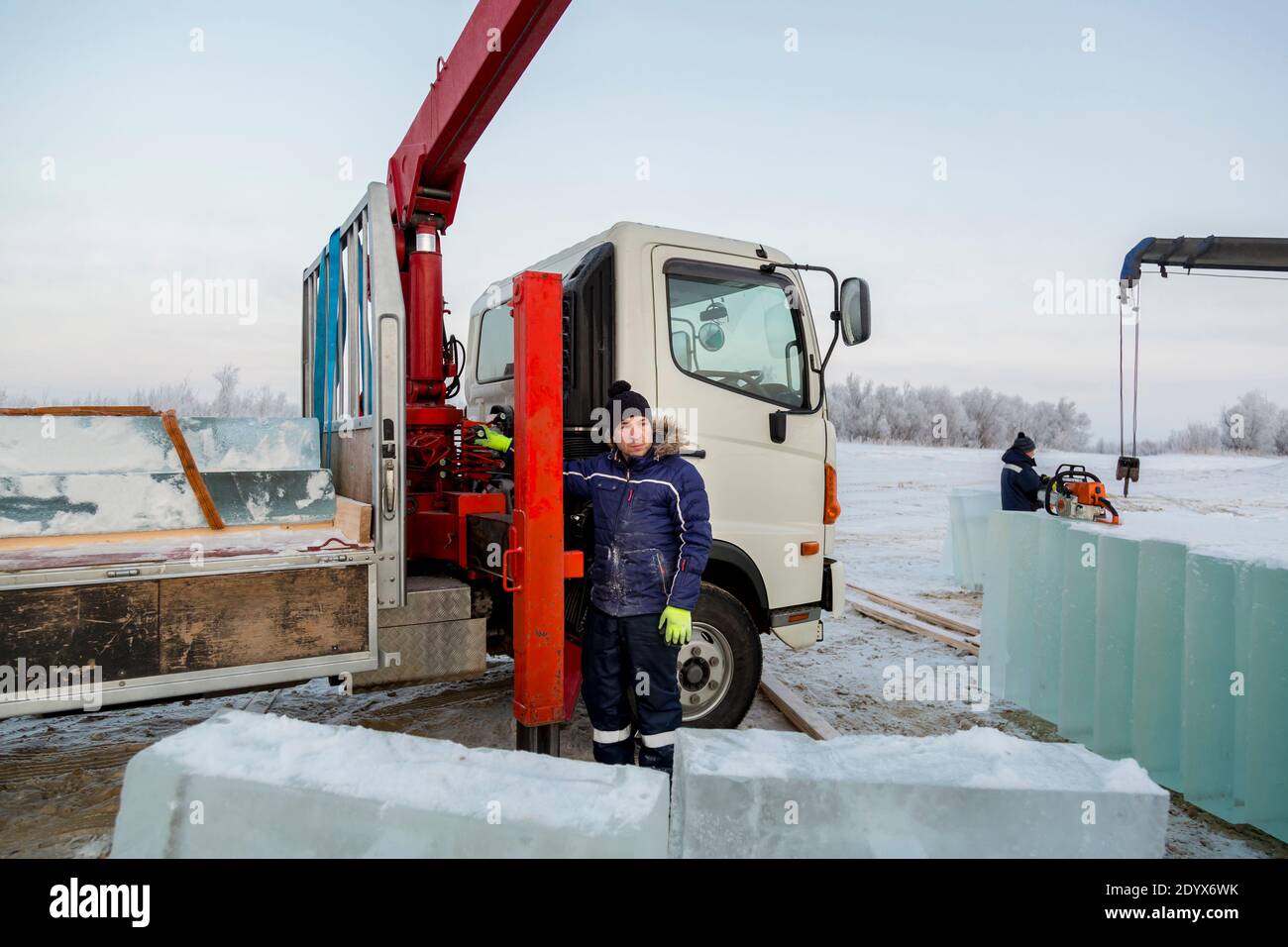 Portrait of a hydraulic crane operator loading ice panels Stock Photo