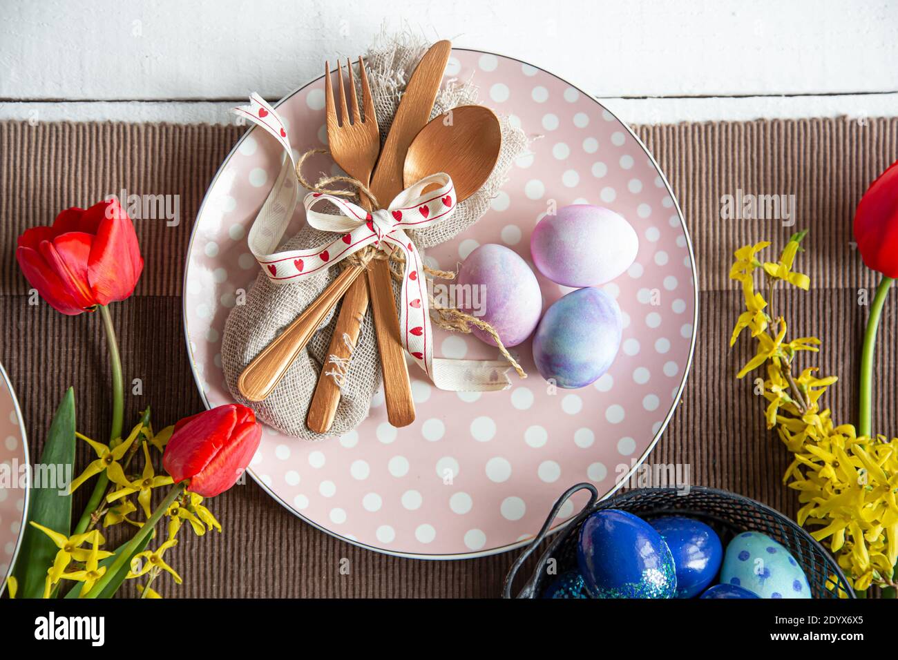 Close up idea for setting a festive table for the Easter holiday. Stock Photo