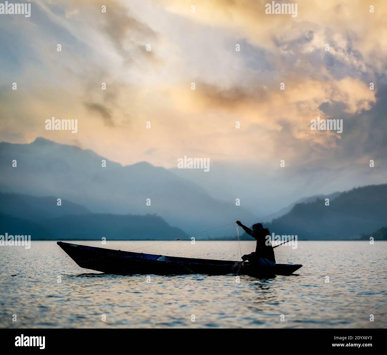 Fisherman in boat on lake hi-res stock photography and images - Alamy