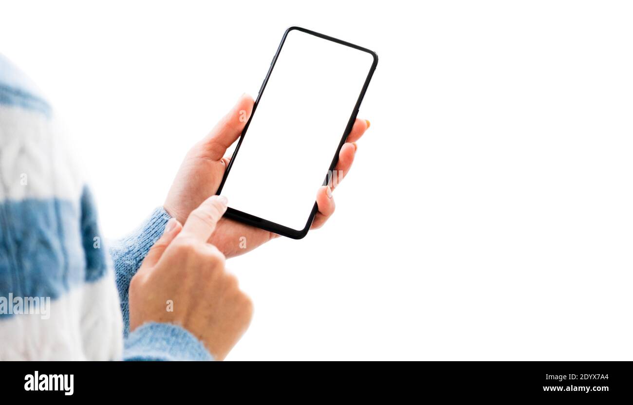 Hand holding mobile phone with white screen isolated on a white ...