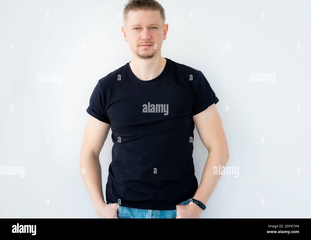 Handsome man posing in black blank t-shirt Stock Photo