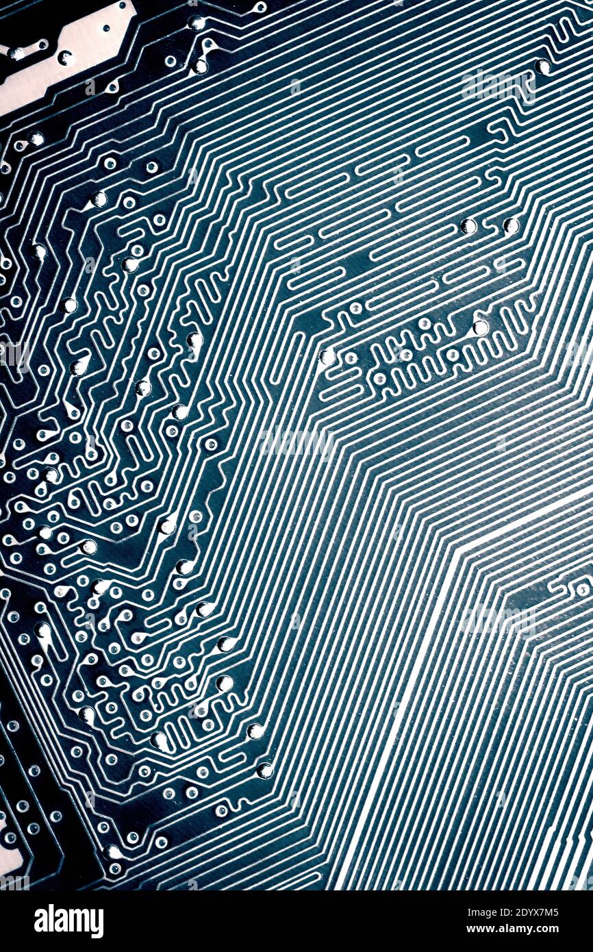 Blue electronic mother board circuit close up macro background. Stock Photo