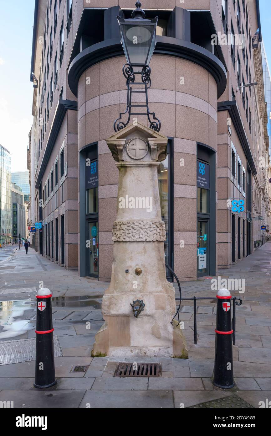Aldgate Pump is a historic water pump in London, located at the junction where Aldgate meets Fenchurch Street and Leadenhall Street. Stock Photo