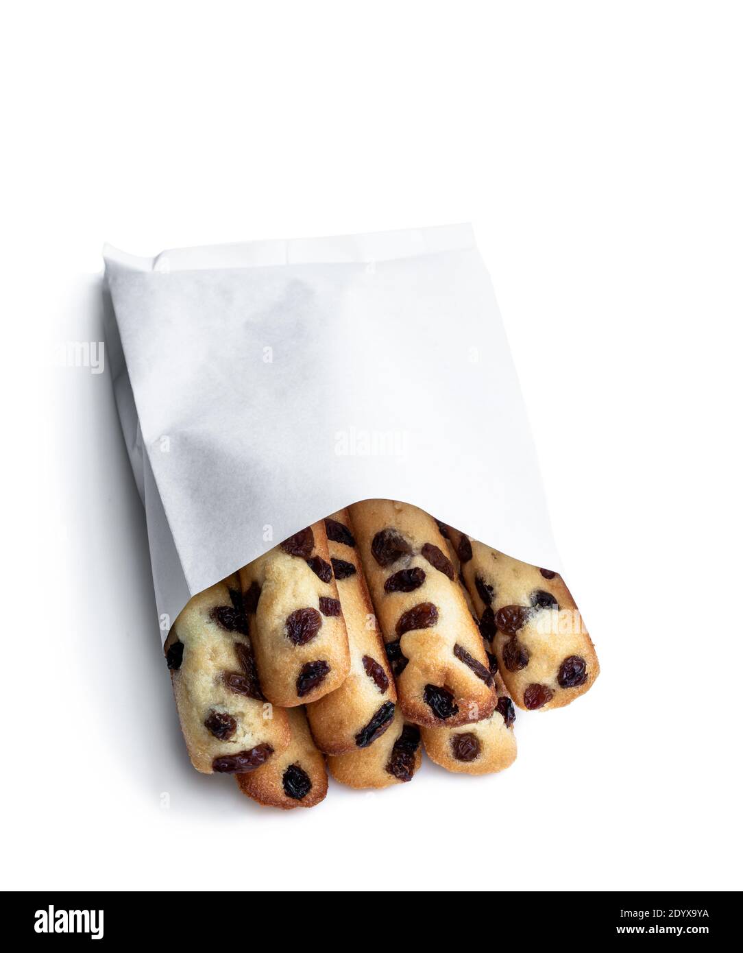 Sponge cake fingers with sultanas in paper bag isolated on white Stock