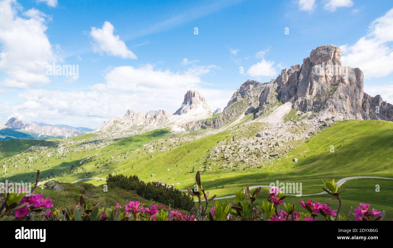 Beautiful Dolomites and clouds in the sunny sky in Italy Stock Photo ...