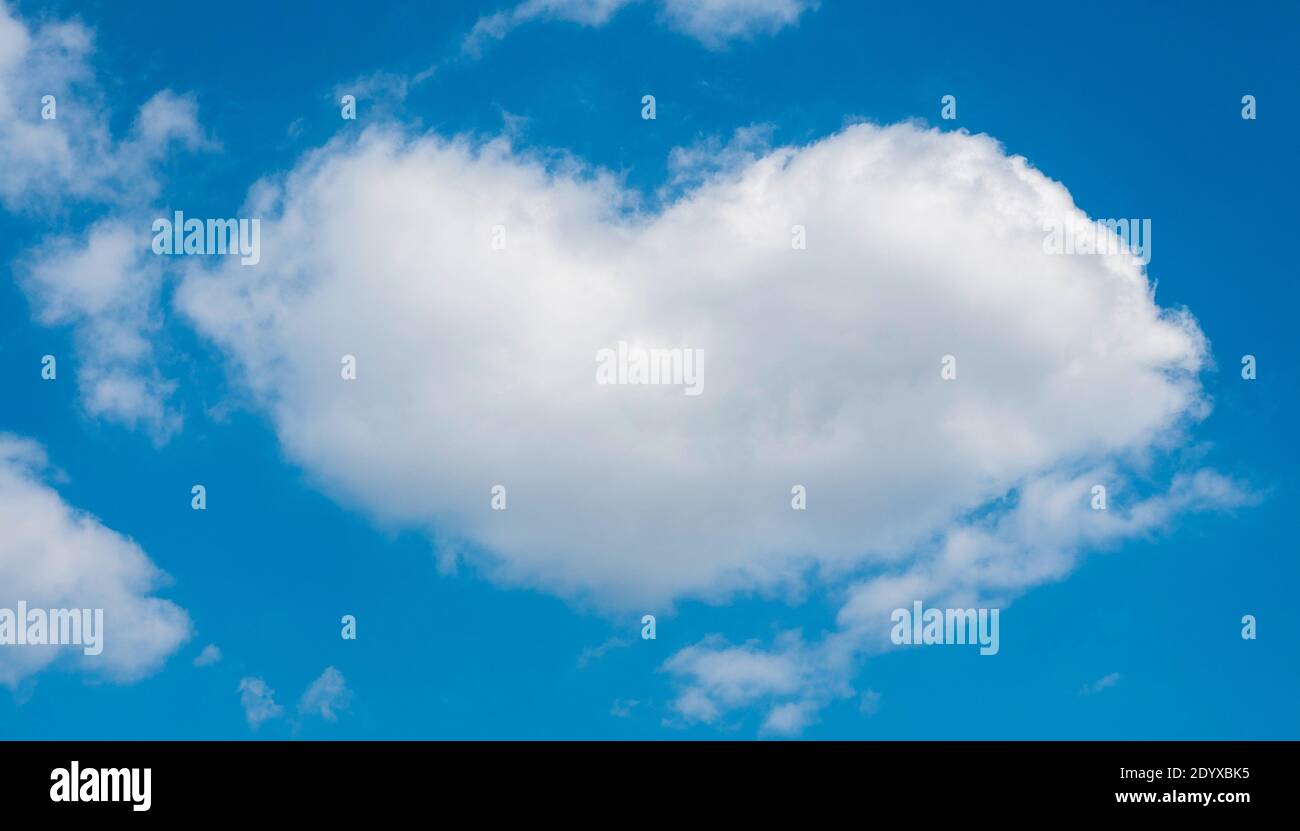 A heart-shaped cloud against the blue sky Stock Photo